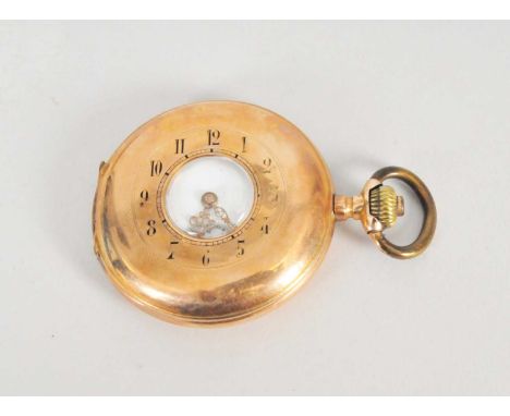A yellow metal half hunter pocket watch, the white enamel dial with Arabic numerals and subsidiary seconds dial, the case sta