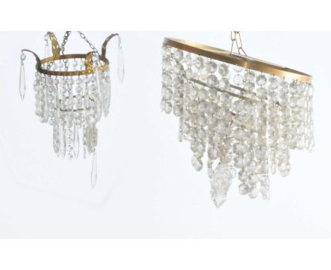 A three-tier hanging ceiling light with clear cut glass droplets, together with a smaller example (2).
