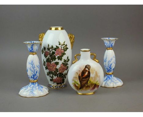 A pair of Coalport candlesticks, circa 1885, transfer-printed in blue with seaweed, gilded decoration to the collars, printed