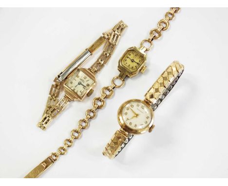 A lady's Art Deco yellow metal Bucherer wristwatch, the canted square dial with Arabic numerals, stamped '14k', with yellow m