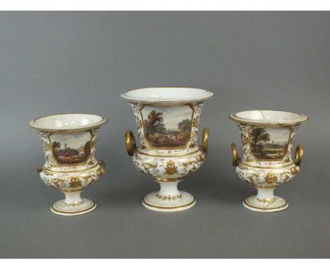 A garniture of three Derby named view vases early 19th century of campagna form, decorated with scenes of 'View Near Astbury,