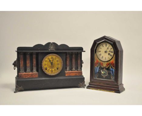 A late 19th / early 20thc century American black mantle clock, of architectural form, simulating slate and marble, 34cm high,