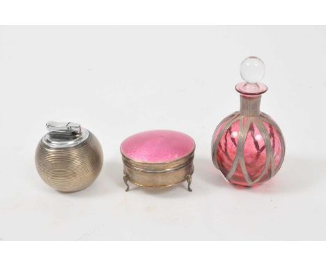 An enamel and silver box, a Comyns 'Witchball' silver table lighter and a cranberry glass scent bottle with white metal mount