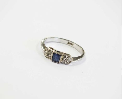 A three stone sapphire and diamond ring, the central square cut sapphire flanked to each side by three graduated faceted diam