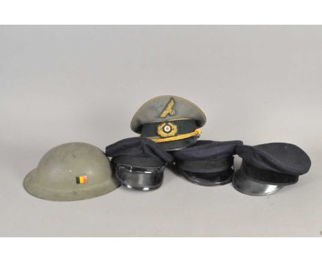 A German Third Reich style Army General's visor cap, together with two German Naval visor caps, a further dark navy visor cap