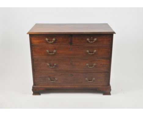 A George III mahogany rectangular chest of drawers, with two short and three long graduated, cockbeaded drawers, all with esc