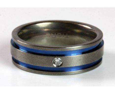 A gents diamond set titanium band, (P).