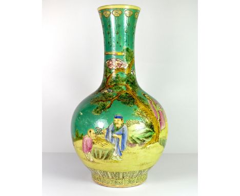 A fine Chinese hand enamelled porcelain bottle vase painted with five figures playing a board game beneath a pine tree, H. 41