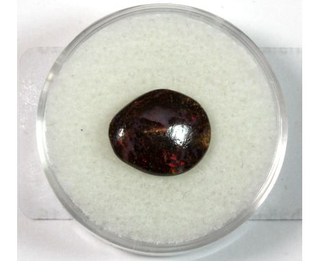 A un-mounted Australian boulder opal with brilliant red flashes, approx 10 x 12mm.