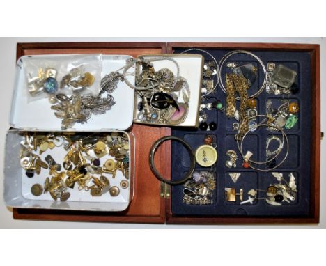 A box of mixed costume jewellery and a tin of vintage cufflinks.