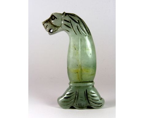 A Chinese carved jade sword hilt, L. 12cm.