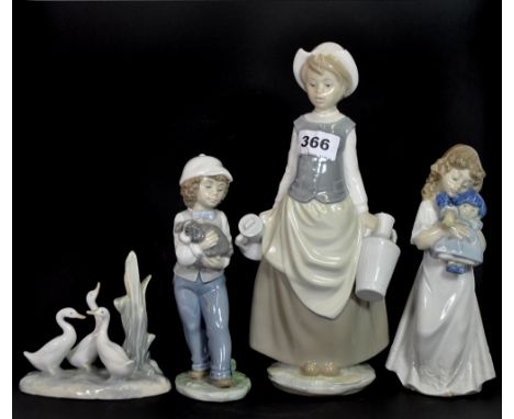 A Lladro figure of a girl (slightly A/F) and three Nao figures.