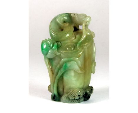 An interesting Chinese mixed colour jade figure of a young dragon on a lotus pod, H. 6.5cm.