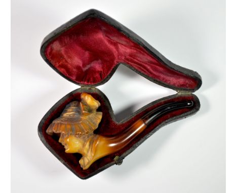 A cased Victorian Meerschaum pipe of a lady wearing a hat, L. 11.5cm.
