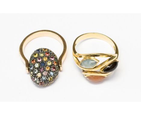 A three stone gold plated ring plus another gem set ring, ring sizes V and O