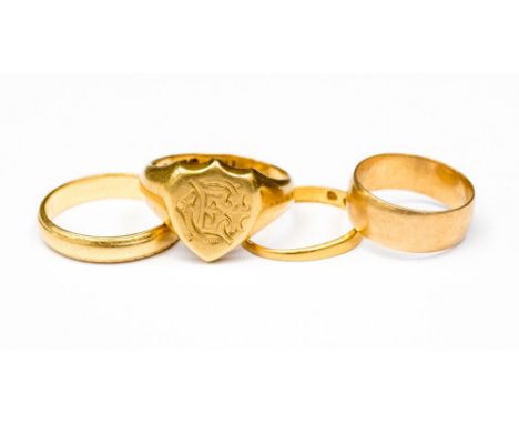 An 18ct gold signet ring, engraved monogram and two 18ct rings, approx 17 grams total and a 22ct  gold ring (4) 