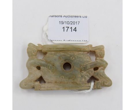 A Chinese carved jade pendant, in the form of two figures either side of a disc