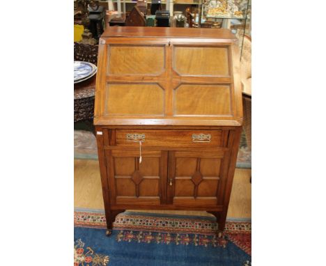 An early 20th century mahogany bureau, the fall front enclosing a fitted interior, single drawer below and two cupboard doors