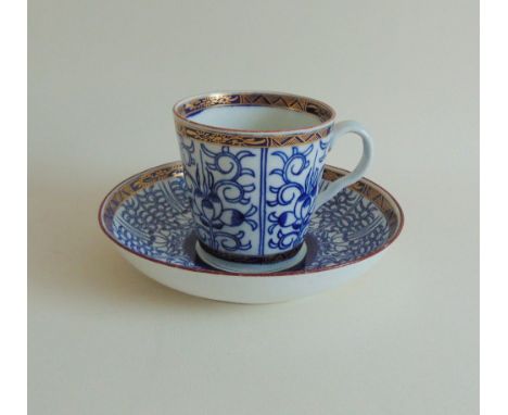 A Worcester Flight coffee cup and saucer, decorated in the Queen Charlotte Royal Lilly Pattern, circa 1788, saucer marked Blu