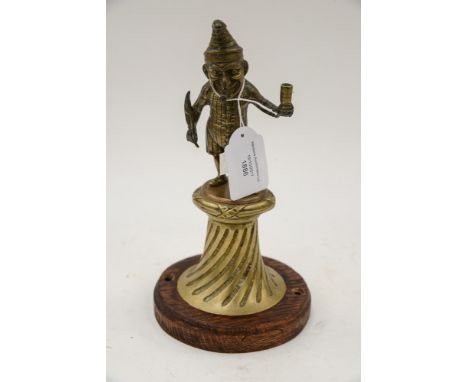 Mr Punch Tobacconist counter cigar lighter late 19th Century (on later base) the cast brass figure of Punch standing holding 