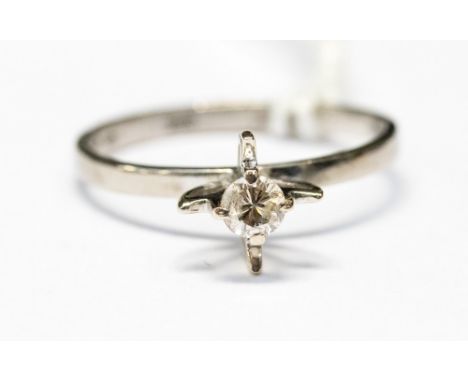 A diamond 18ct white gold solitaire ring, the fancy set diamond weighing approximately 0.20 carat in stylised flower mount, r