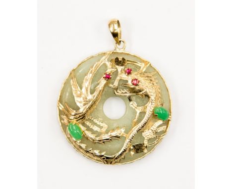 A jade 14ct gold circular pendant with applied gold phoenix and jade gem set decoration, approximately 30 mm in diameter 