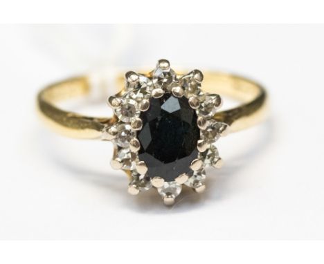 A sapphire and diamond 18ct yellow gold cluster ring, ring size 0. gross weight approximately  4.1 grams 