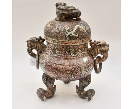 A large jade type bowl and cover, standing on three claw feet, having mystical snarling dragon as finial to the cover