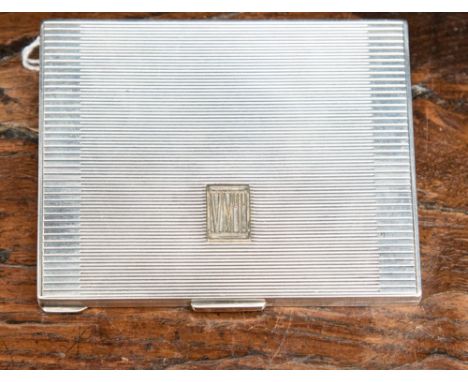 A George VI silver cigarette case, reeded edges, the body engine turned with geometric lines, the hinged cover set with monog