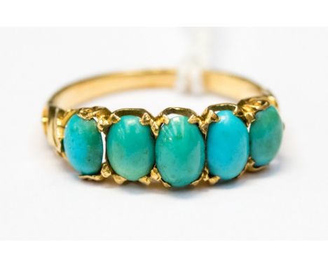 A turquoise five stone yellow gold ring, size O, approx 3.0gms