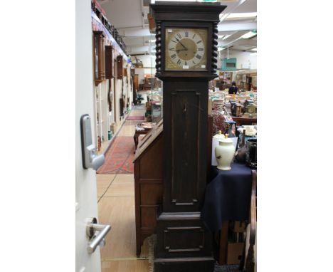 An early 20th Century oak longcase clock, with an eight day movement, complete with a Westminster chime