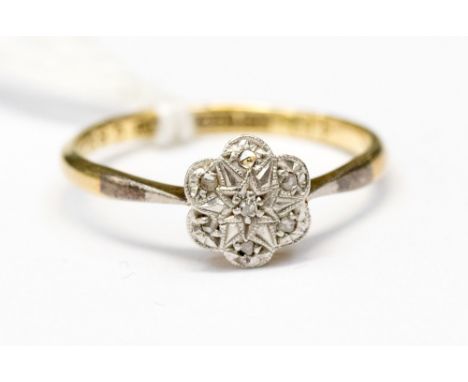 A diamond ring set as a flower, 18ct yellow gold and platinum set, ring size M 1/2