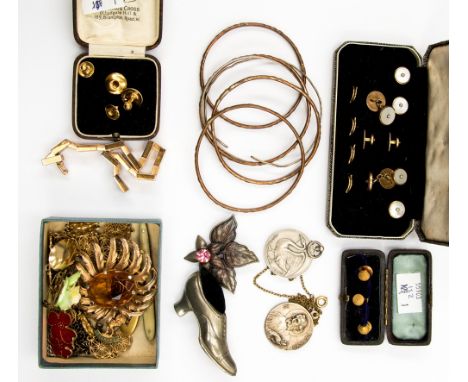 Costume jewellery including gilt metal paste brooches, pendants, necklaces, ceramic brooch, bangles, a cousage, codirol brooc