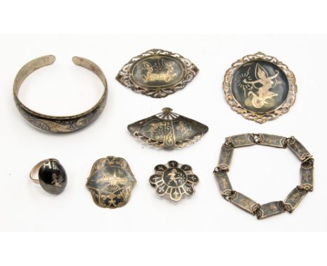 A quantity of Siamese Niello jewellery to include, five brooches, a bangle, bracelet and ring (8) 