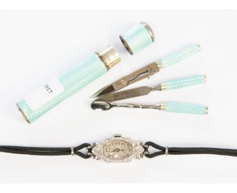 A 1930's Art Deco 18ct white gold lady's diamond cocktail wristwatch,. 1.2cm oval silvered dial with stylized diamond set bez