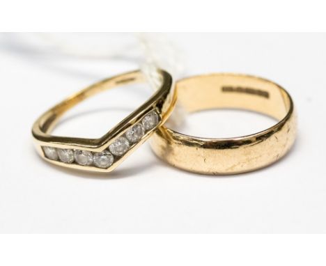 A 9ct gold band, size K, along with a white stone channel set wishbone ring, size I1/2, with a combined total gross weight 3.