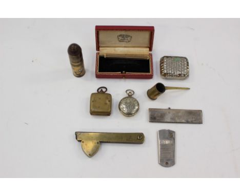 A collection of curios to include two Half Sovereign holders, comb, razor, propelling pencil, trench art lighter, snuff box, 