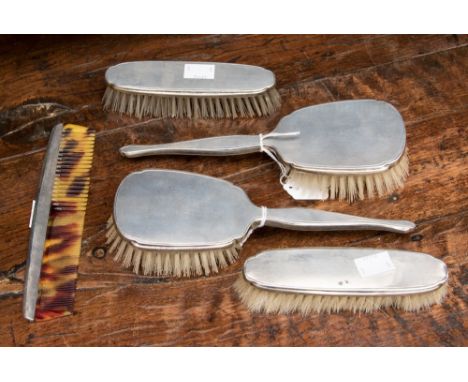 A George VI silver ladies dressing table set, Mappin and Webb, Birmingham 1946, each piece with engine turning to silver back