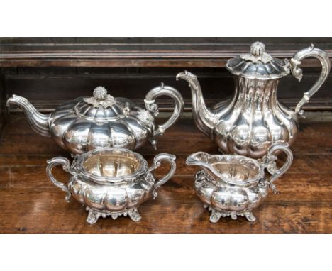 An Elizabeth II four piece silver tea and coffee service, melon-shaped comprising coffee pot, teapot, sugar basin and milk ju