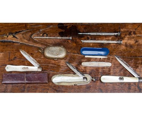 A collection of silver retractable pencils, a tooth pick and four silver and silver and mother of pearl pen knives, along wit