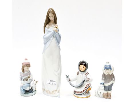 A Lladro figure , 'Fridays Child', and another Lladro figure of a boy and polar bear cub, a Nao figure of a tall lady and a R