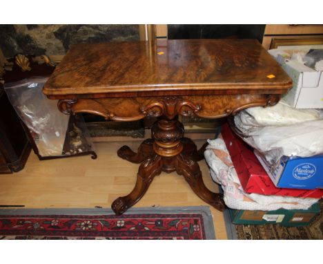 A mid Victorian burr walnut veneered pedestal card table