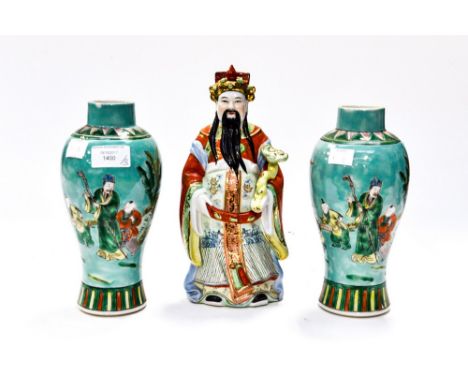A pair of turquoise Chinese vases, with playing children scenes; together with a figure of an Oriental immortal (3) 