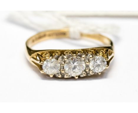 A nine carat gold three stone ring, with cubic zirconia or similar stones, approx size P