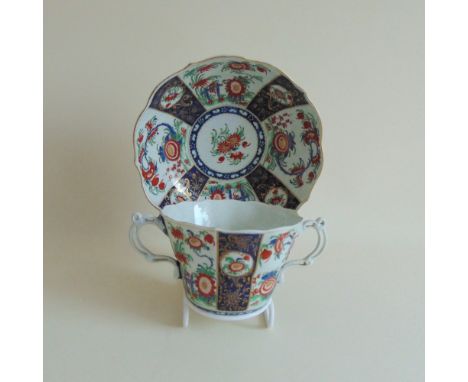 A Worcester chocolate cup and saucer painted in Kakiemon colours in the Queens pattern, circa 1770, cup, 9.5 cm diameter, 7.5