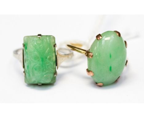 A carved jadeite set 9ct gold ring together with a jadeite cabochon 9ct gold ring (2)