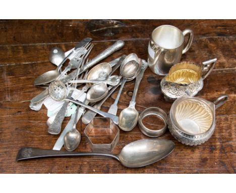 A quantity of Georgian and later silver items to include: Christening mug, two cream jugs, knife and fork set, sugar sifter, 