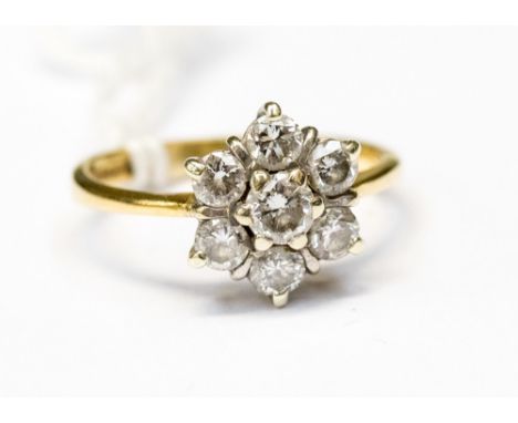 An eighteen carat gold flower cluster ring, approx total diamond weight 0.75carat, approx ring size K, approx total gross wei