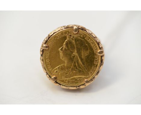 A full Sovereign signet ring, the coin dated 1899 in a 9ct gold mount and shank, gross weight 15.5 grams approx 