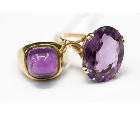 A 9ct amethyst ring, set cabochon and anther with oval faceted amethyst (2) 